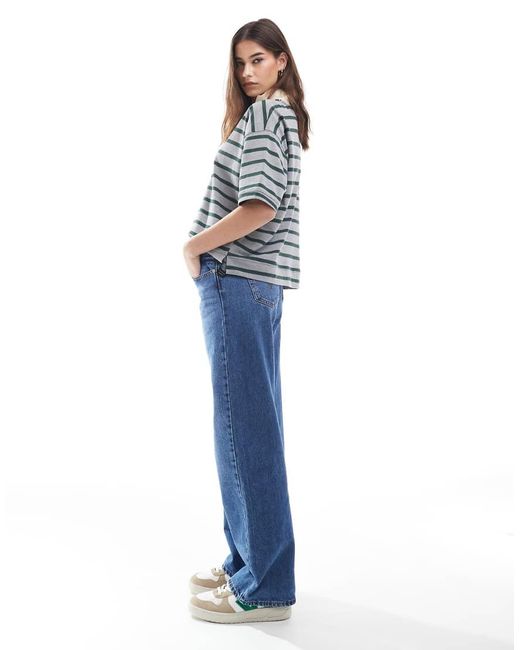 Jeans Ampi Lavaggio Medio Con Vita Super Bassa di Levi's in Blue