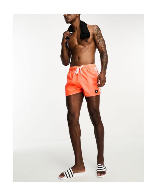 Adidas Originals Orange Adidas Swim 3 Stripe Shorts for men
