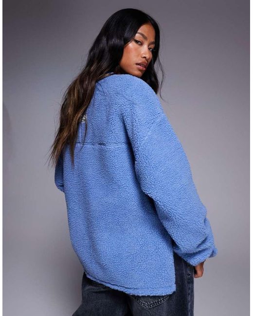 ASOS Blue Weekend Collective Borg Sweatshirt With Embroidered Graphic