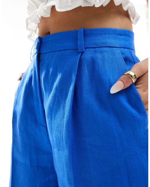 Pantalon slim en lin avec taille élastique Mango en coloris Blue