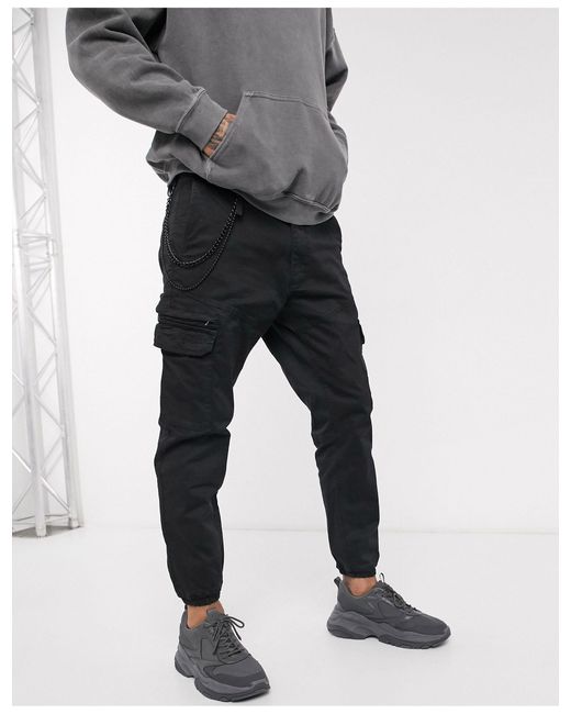 black cuffed utility trousers