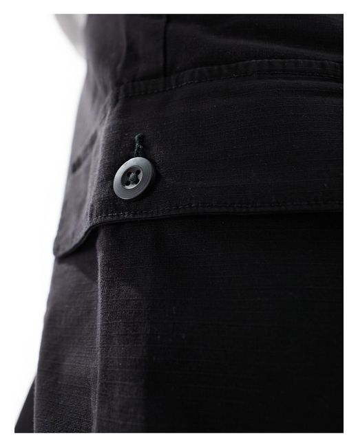 Pantaloni cargo a fondo ampio neri di Bershka in Black da Uomo