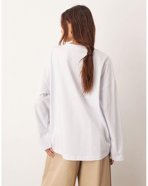 ARRANGE White – langärmliges oversize-t-shirt aus baumwolle