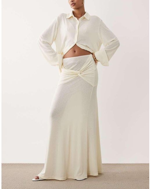 SNDY'S Natural Soft Fine Knit Semi Sheer Ruched Twist Front Detail Maxi Skirt