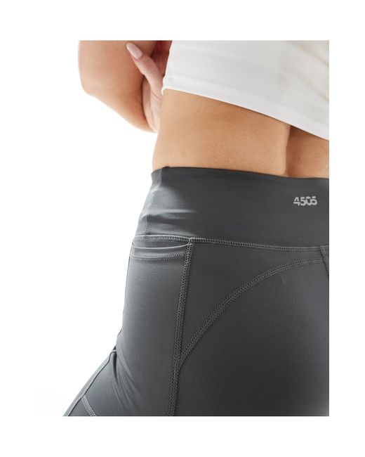 Leggings deportivos gris para correr con lazada en la cintura y bolsillo para móvil icon ASOS 4505 de color Black