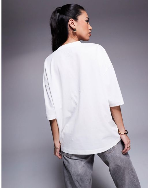 T-shirt unisexe coupe carrée oversize à imprimé university of california ASOS en coloris Blue