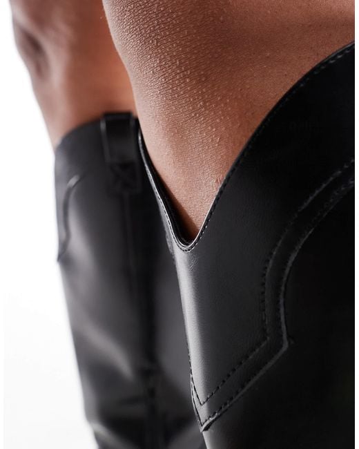 Curve - claudia - bottes montantes style santiags ASOS en coloris Black