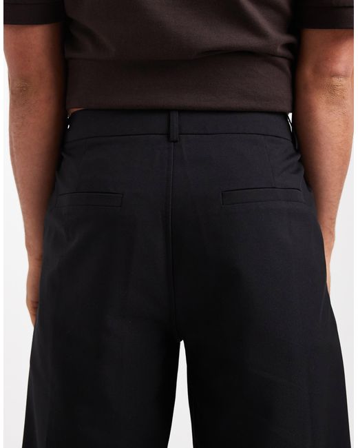 Collusion Black Tailored Relaxed Trousers for men
