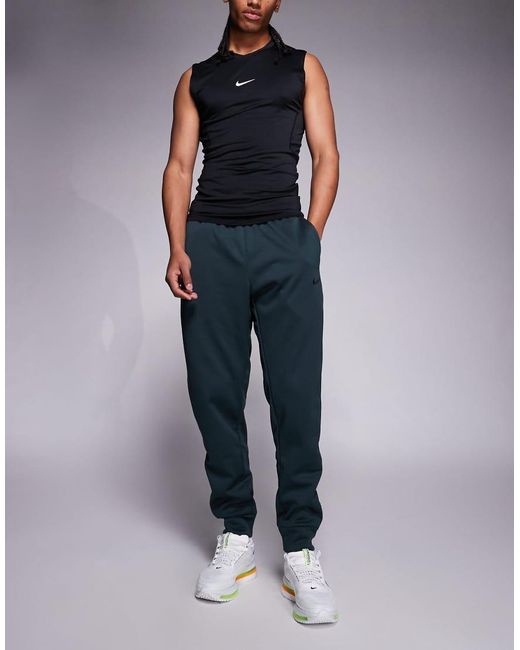 Nike Blue Therma Tapered Trousers for men