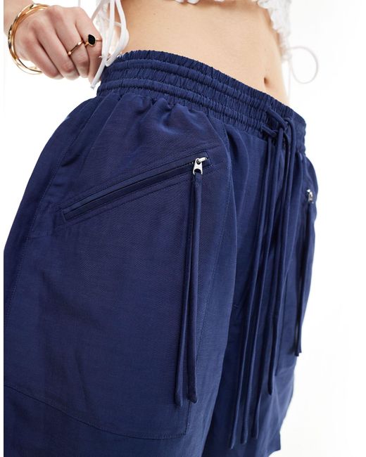 Pantalones cortos es con cintura elástica y bolsillos con cremallera & Other Stories de color Blue