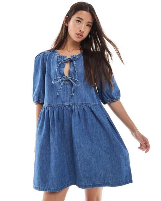 Vestido Corto Vaquero Azul Medio Con Mangas Abullonadas Y Lazadas Delanteras De New Look ONLY de color Blue