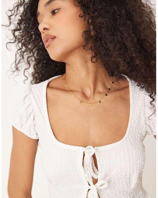 Top Estilo Babydoll Con Lazadas Delanteras De Tejido Texturizado De ASOS de color Natural