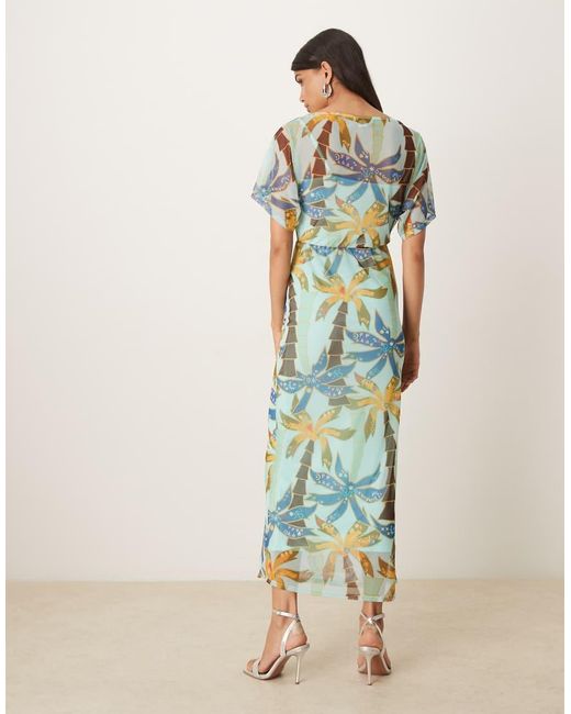 Vestido Largo Asimétrico Con Estampado De Palmeras De Malla Tilly De Never Fully Dressed de color Blue