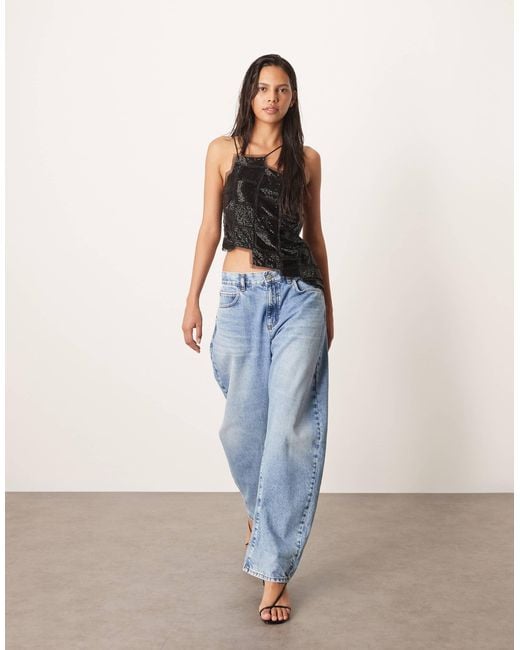 ARRANGE Blue Embellished Asymmetric Top With Raw Edge