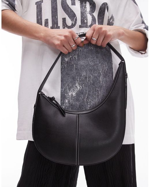 Samina - sac porté épaule asymétrique et incurvé TOPSHOP en coloris Black
