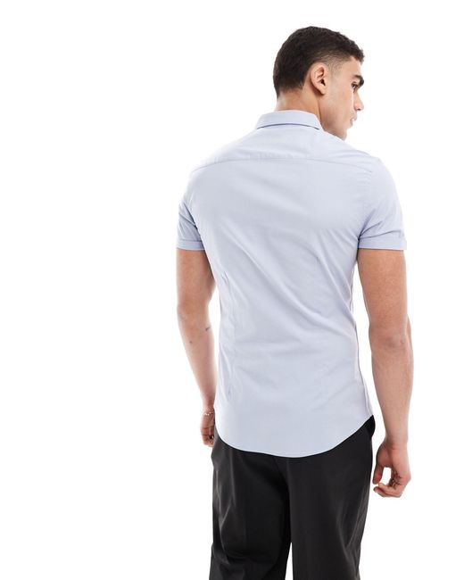 Camicia skinny con maniche risvoltate azzurra di ASOS in White da Uomo