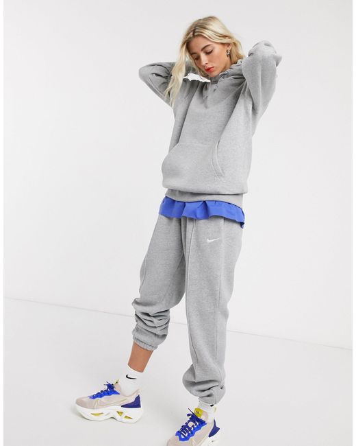 nike mini swoosh oversized sweatpants in cream