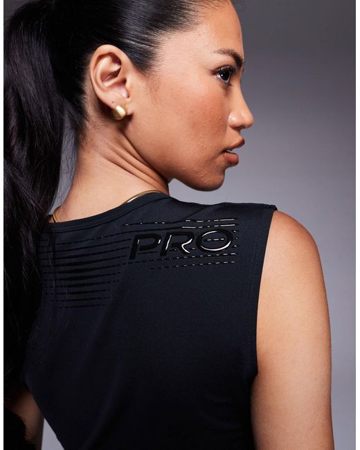 Pro - débardeur court en tissu dri-fit Nike en coloris Blue