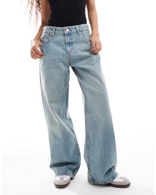 Asos design petite - jean baggy à taille basse - pâle vintage ASOS en coloris Blue