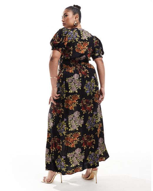 Asos design curve - robe mi-longue à manches bouffantes et imprimé fleurs vintage avec liens noués devant - noir ASOS en coloris Multicolor