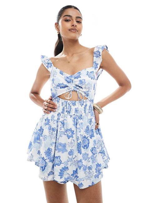 Mono Corto Azul Con Estampado Floral, Abertura Y Mangas Con Volante De Hollister de color Blue