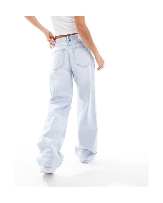 Petite - dad jeans a fondo ampio lavaggio chiaro di Stradivarius in White