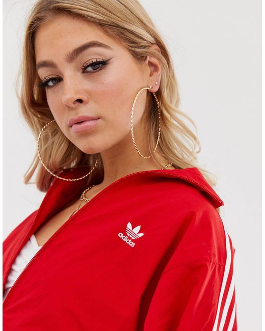 Adidas originals locked up hotsell logo track jacket in red