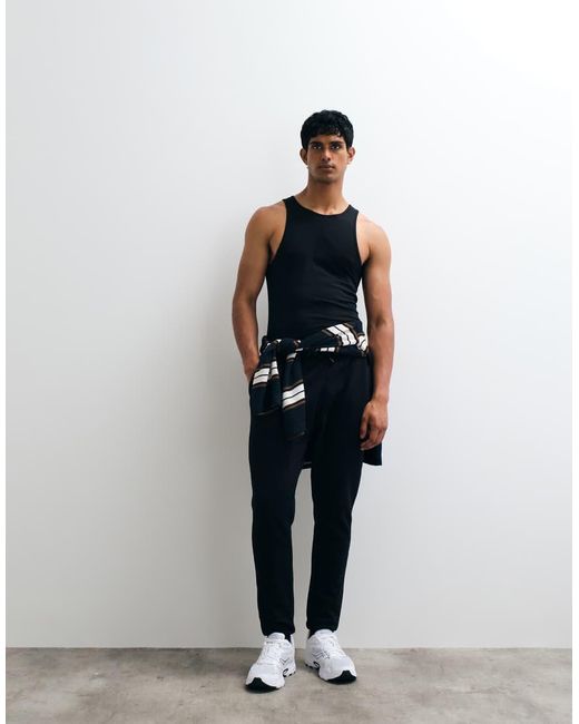 Joggers Negros Básicos De Corte Slim De ASOS de hombre de color Black