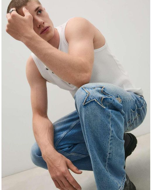 Bershka Blue baggy Jeans With Print And Patches for men