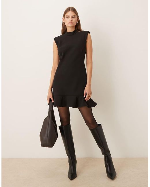 Mango Hoogsluitende Mouwloze Mini-Jurk Met Structuur En Peplumzoom in het Black