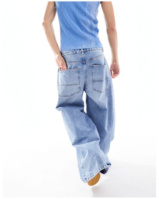 X015 - jeans super baggy a vita bassa lavaggio medio di Collusion in Blue da Uomo