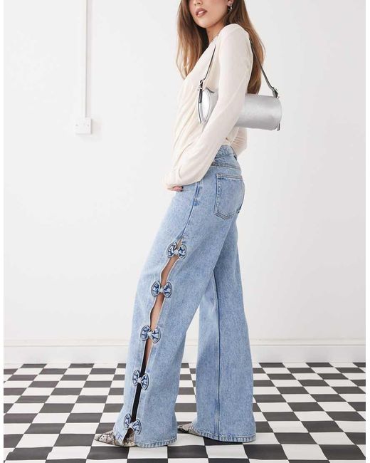 Monki Blue Imoo Low Waist Wide Leg Jeans With Cut Out Bow Details