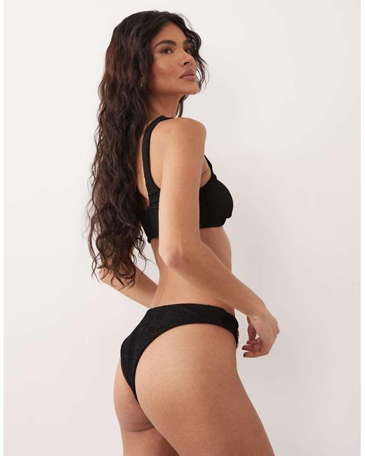 The Frolic Black Exclusive Crinkle Metal Flower Trim High Leg Brazilian Bikini Bottom