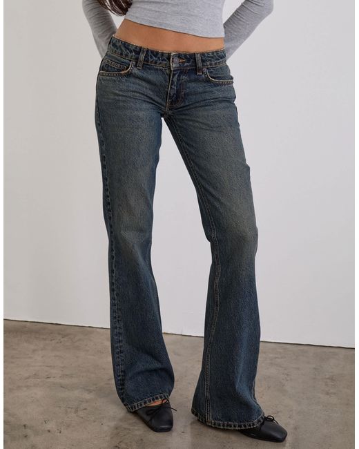 Motel Extra Low Rise Flare Jeans in Gray | Lyst