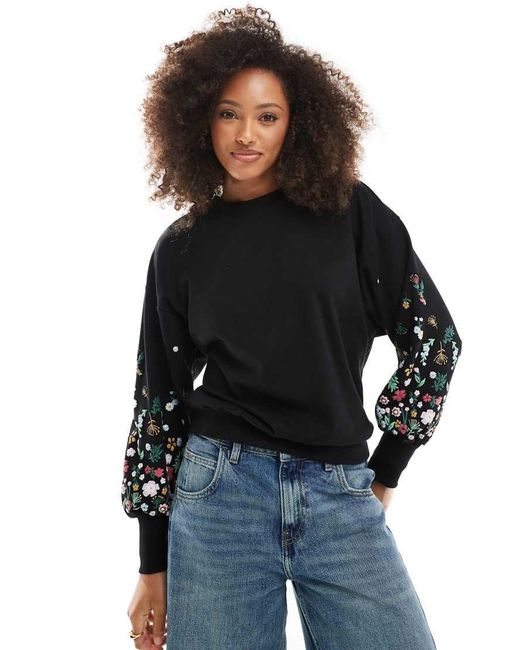 Jersey Con Cuello Redondo Y Detalle De Flores En Las Mangas De ONLY de color Black