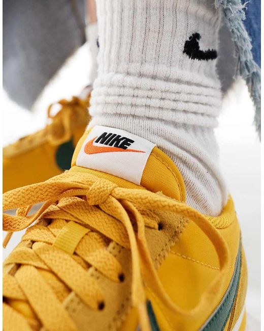 green and yellow nike trainers