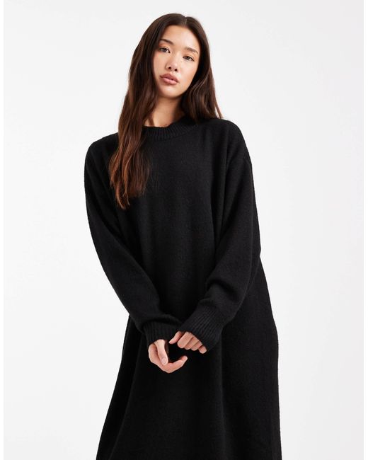 Robe pull mi-longue en maille avec manches longues Monki en coloris Black