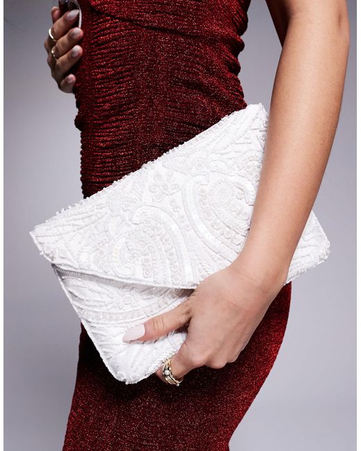 True Decadence Red – gemusterte envelope-clutch