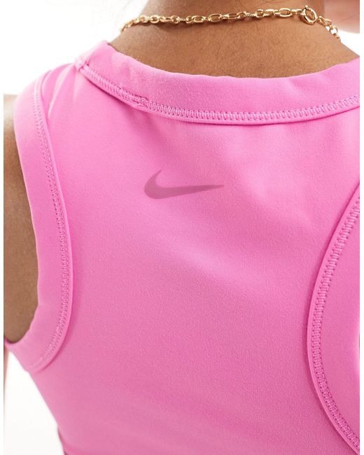Nike - one training - débardeur moulant en tissu dri-fit - pastel Nike en coloris Pink