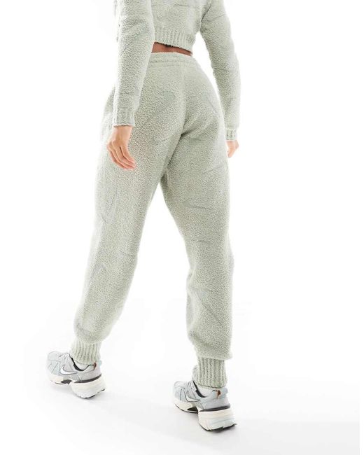 Nike Green Phoenix Boucle All Over Print Swoosh High-waisted joggers