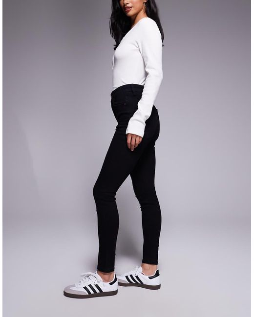 Vaqueros Negros De Corte Pitillo De Asos Design Petite ASOS de color Black