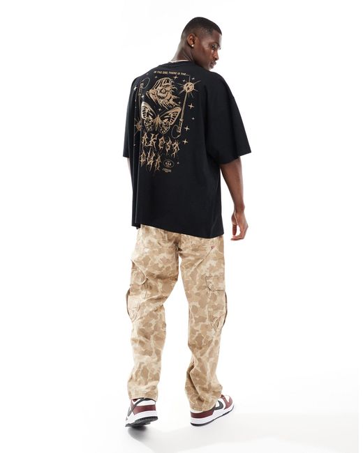 T-shirt ultra oversize à imprimé style grunge au dos ASOS pour homme en coloris Black