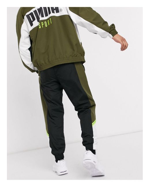 PUMA Tfs Woven joggers Khaki in Green for Men Lyst Canada