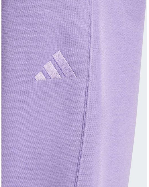 Pantalones Negros Y Blancos Con 3 Rayas Y Bajos Ajustados De Felpa Rizada Essentials De Adidas Originals de color Purple