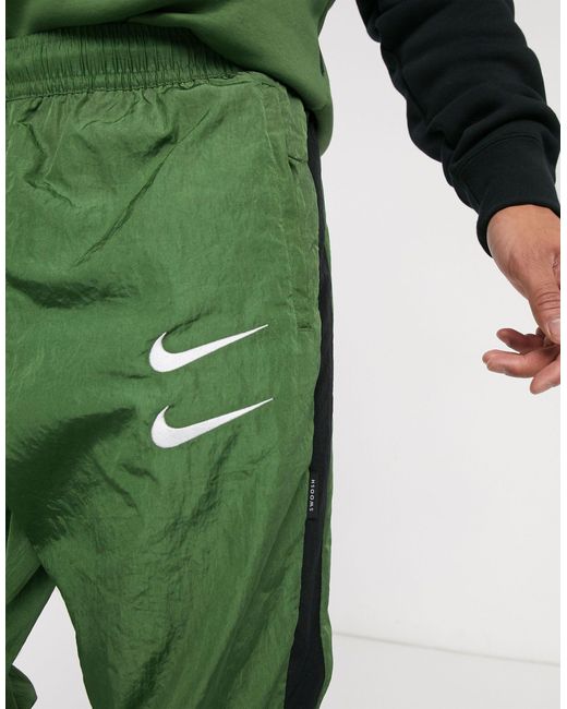 Nike Swoosh - Geweven joggingbroek Met Boorden in het Green voor heren