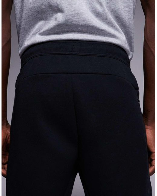 Tech - pantalon Nike pour homme en coloris Black