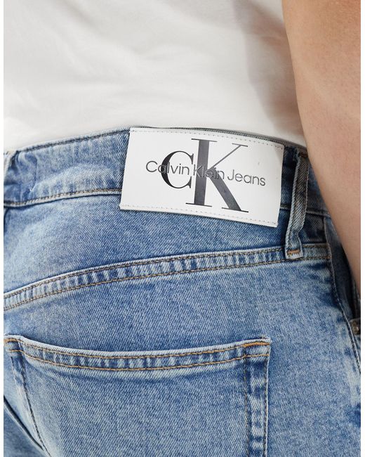 Pantaloncini di jeans regular lavaggio chiaro di Calvin Klein in Blue da Uomo