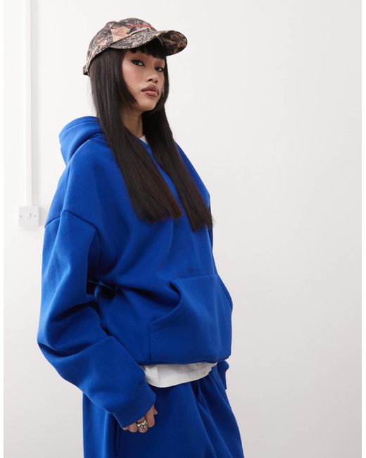 Sweat à capuche décontracté Collusion en coloris Blue