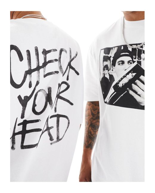T-shirt unisex oversize bianca con stampe dell'album check your head dei beastie boys su licenza di ASOS in White