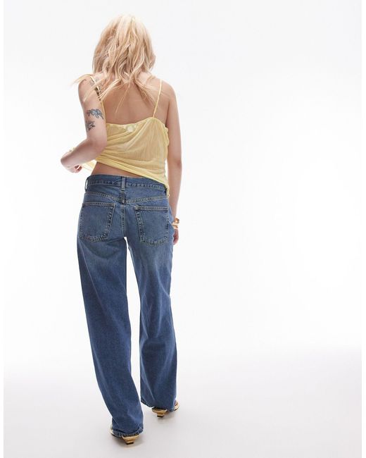 Ember - jeans a fondo ampio e vita bassa medio di Topshop Unique in Blue